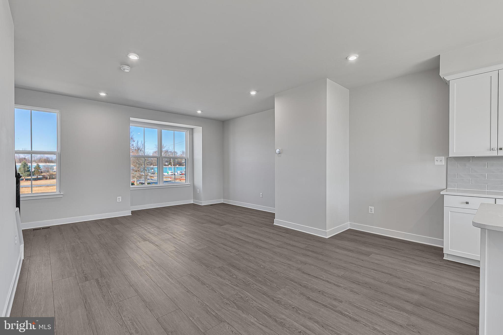 70 C Oasis Avenue Ranson, WV 25438 - Photo 24 of 41 an empty room with wooden floor and windows