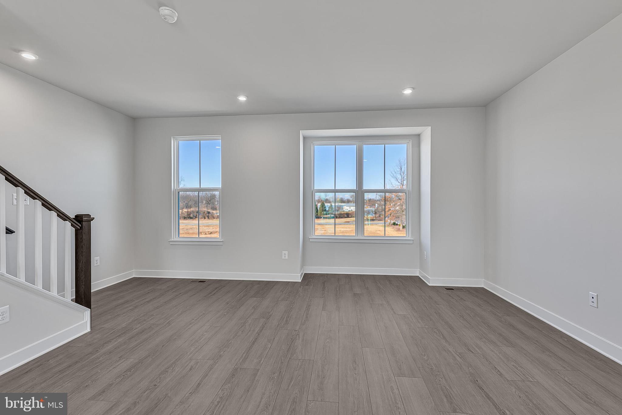 70 C Oasis Avenue Ranson, WV 25438 - Photo 26 of 41 a view of an empty room with wooden floor and a window