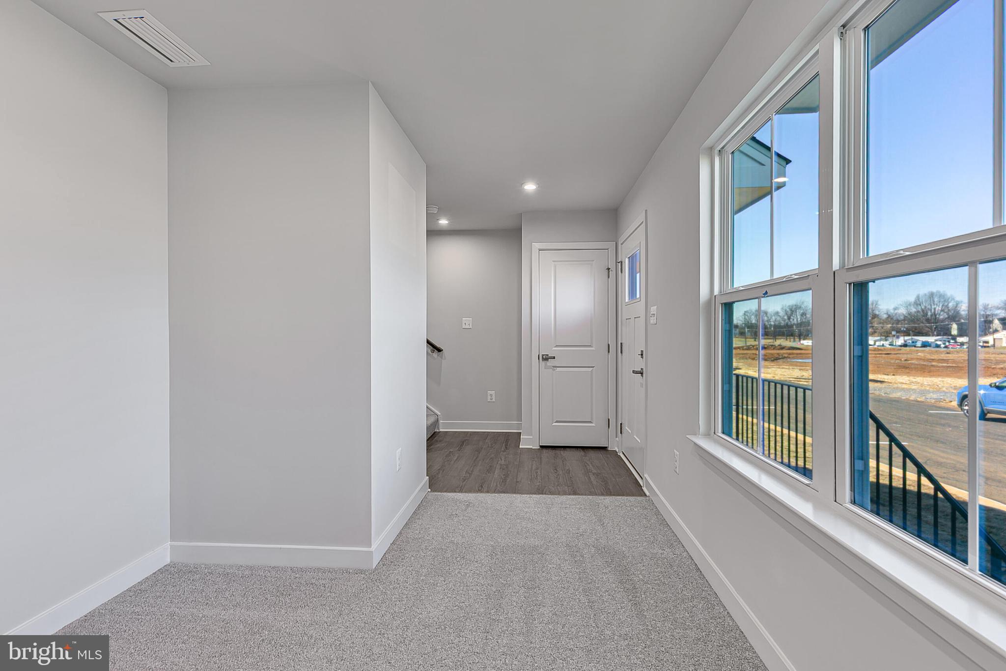 70 C Oasis Avenue Ranson, WV 25438 - Photo 4 of 41 a view of a hallway with windows