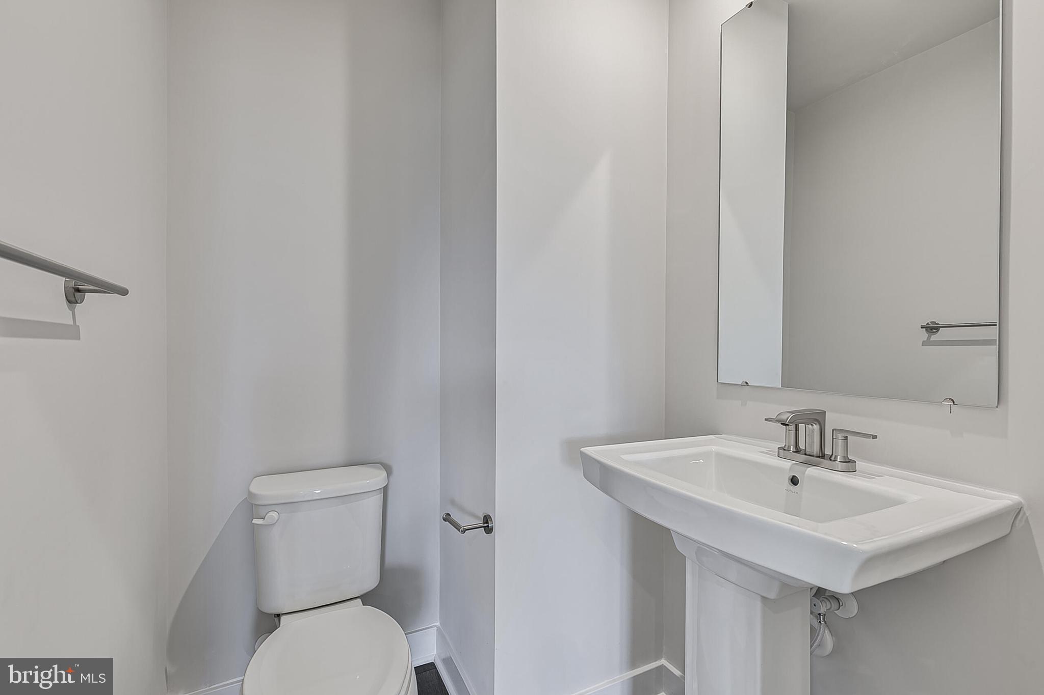 70 C Oasis Avenue Ranson, WV 25438 - Photo 10 of 41 a bathroom with a sink a toilet and a mirror