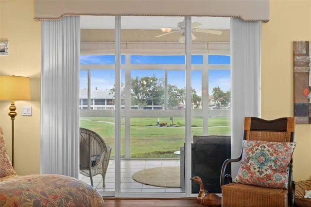 a bedroom with furniture and balcony