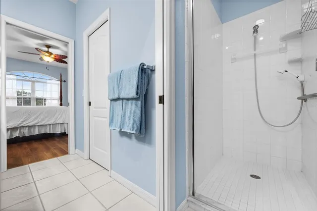 a bathroom with a shower and a sink