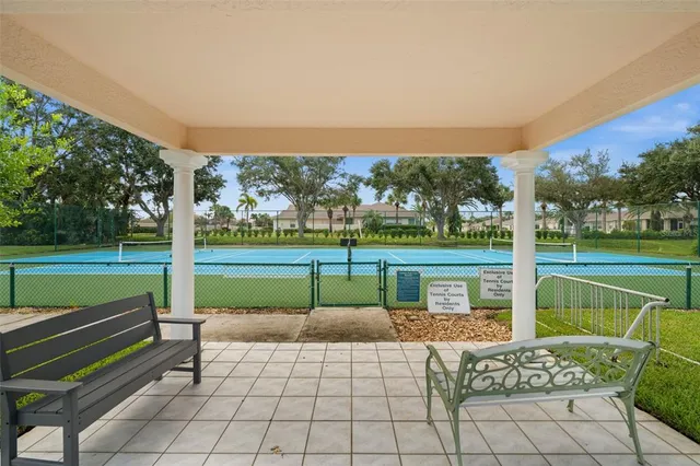 a view of a swimming pool with a patio