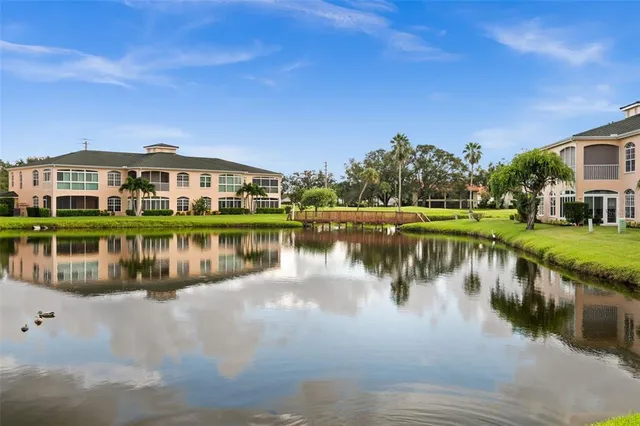 a view of a lake with a house in the background