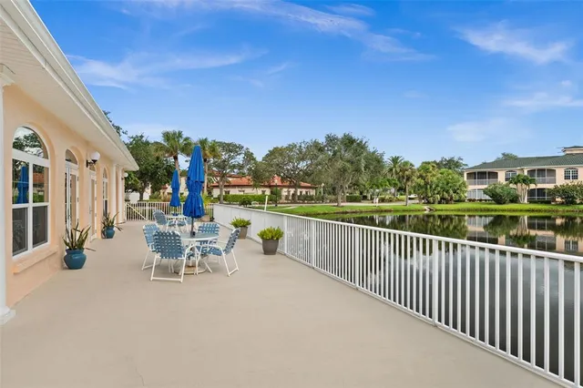 a view of a chair and tables in the balcony