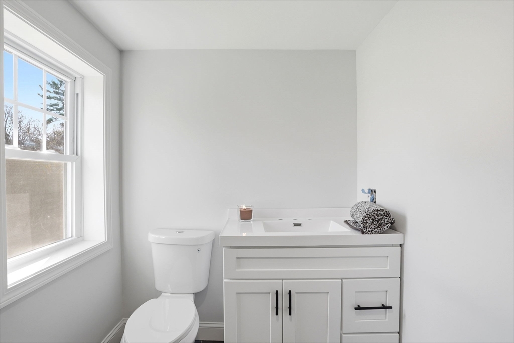 357 Wareham Street Middleboro, MA 02346 - Photo 34 of 42 a bathroom with a toilet sink and mirror