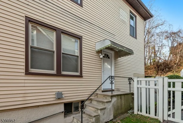 a view of a house with a window and stairs