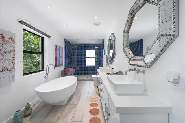 a spacious bathroom with a bathtub and window