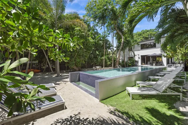 a view of a swimming pool with a patio