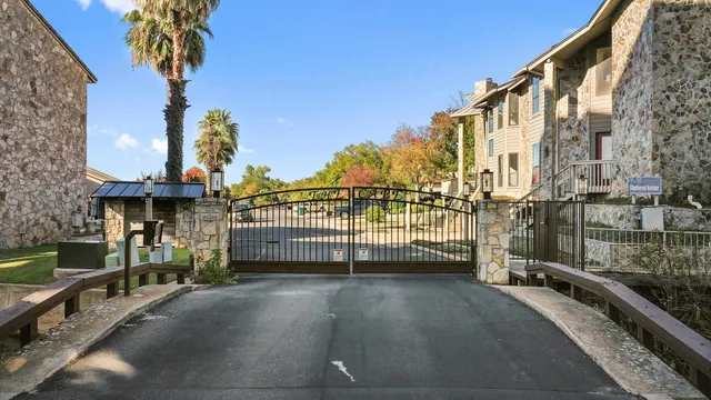 a view of a balcony with a palm tree