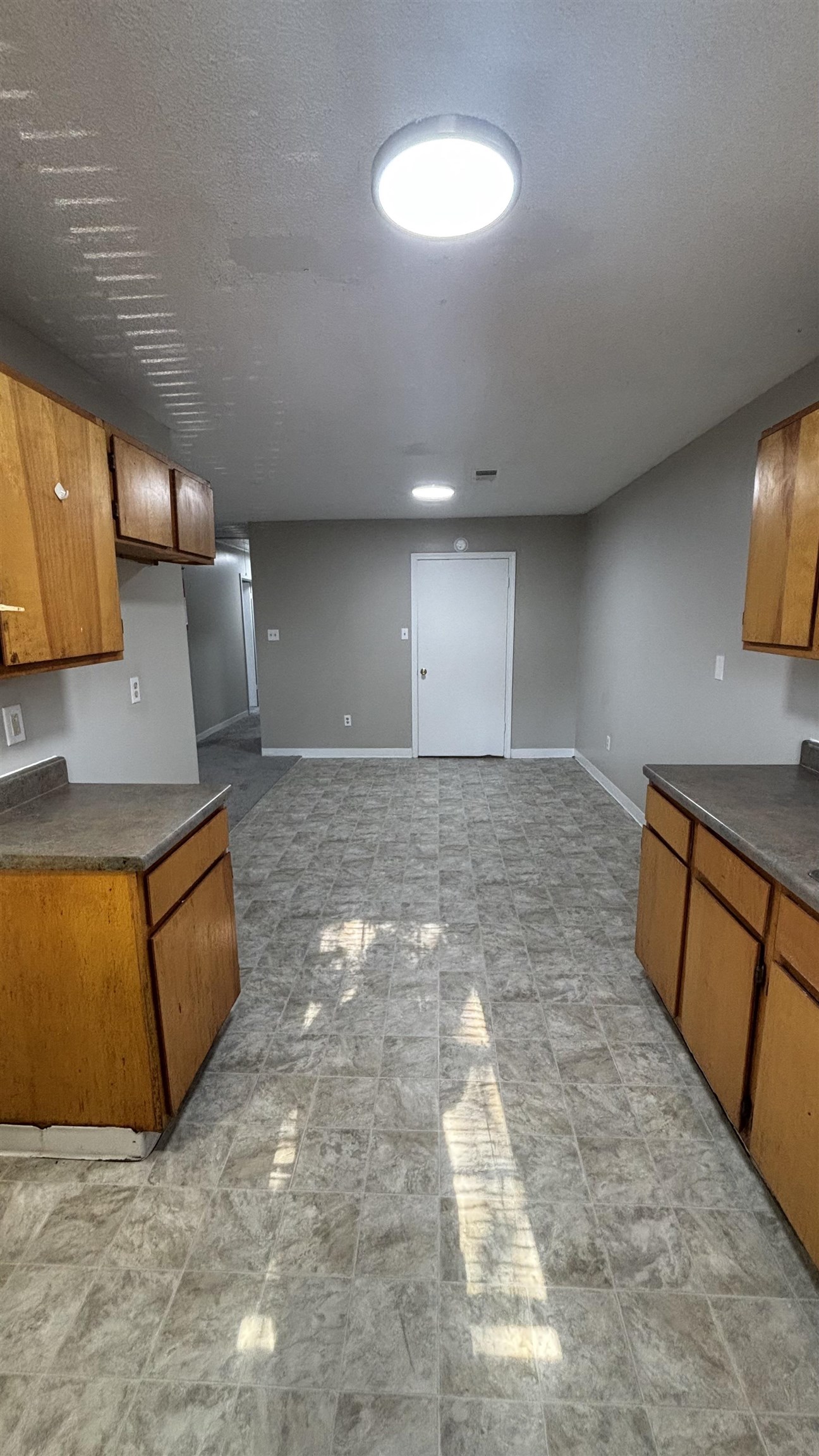 1452 Ledger Road Memphis, TN 38106 - Photo 2 of 3 a view of a kitchen with a sink and a stove top oven