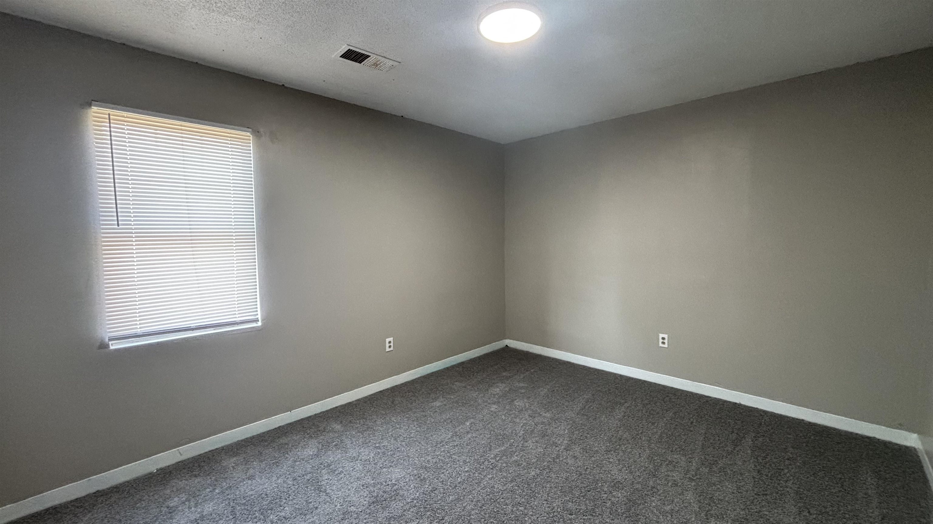 1452 Ledger Road Memphis, TN 38106 - Photo 3 of 3 an empty room with a window