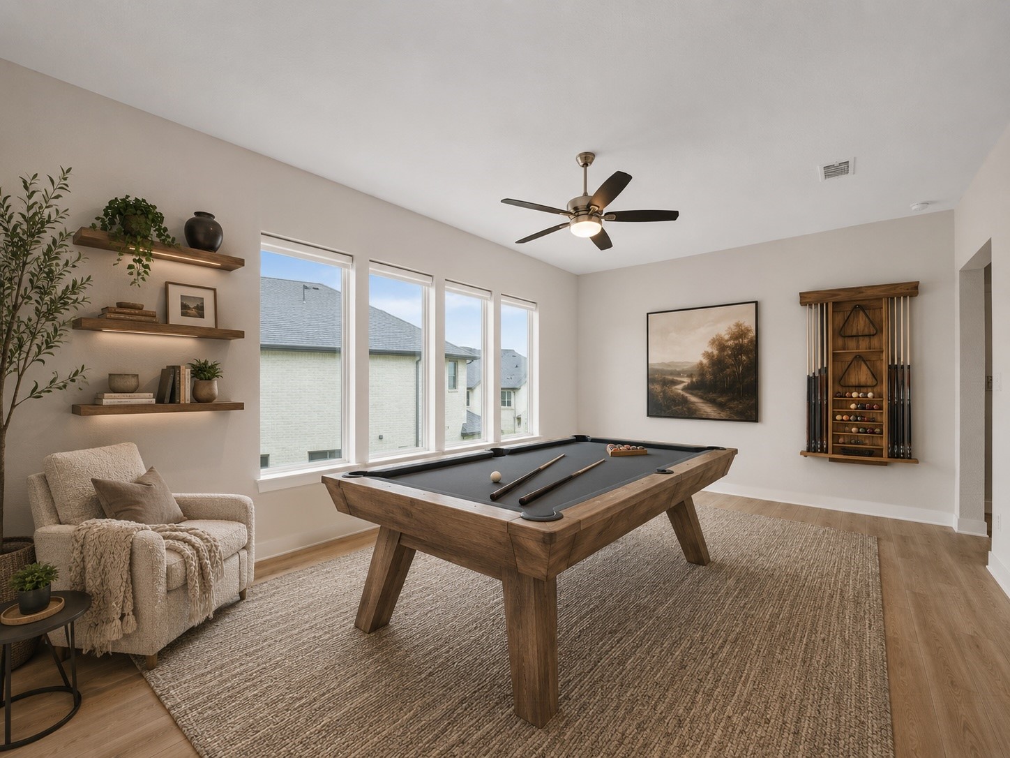 5802 Emerald Ranch Lane Fulshear, TX 77441 - Photo 31 of 45 Virtually staged to highlight its entertaining potential, the expansive game room offers generous open space, beautiful natural light, and plenty of flexibility for a pool table, lounge seating, or additional recreational use.
