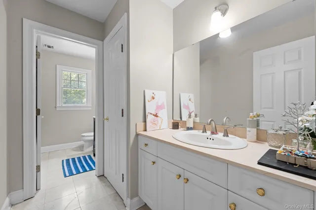a bathroom with a sink double vanity and a mirror