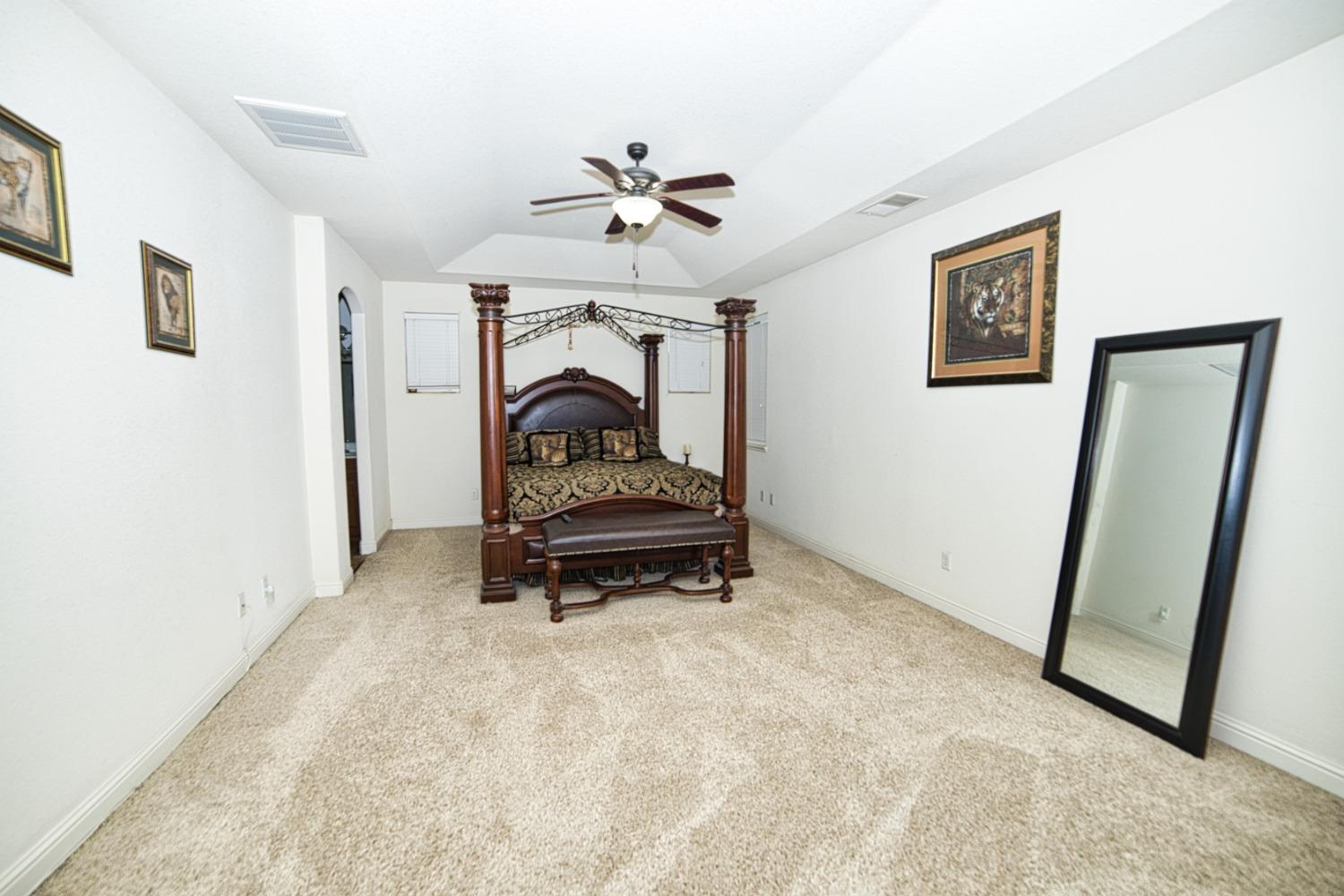 804 Pear Street Madera, CA 93638 - Photo 16 of 27 a room with stairs and a ceiling fan