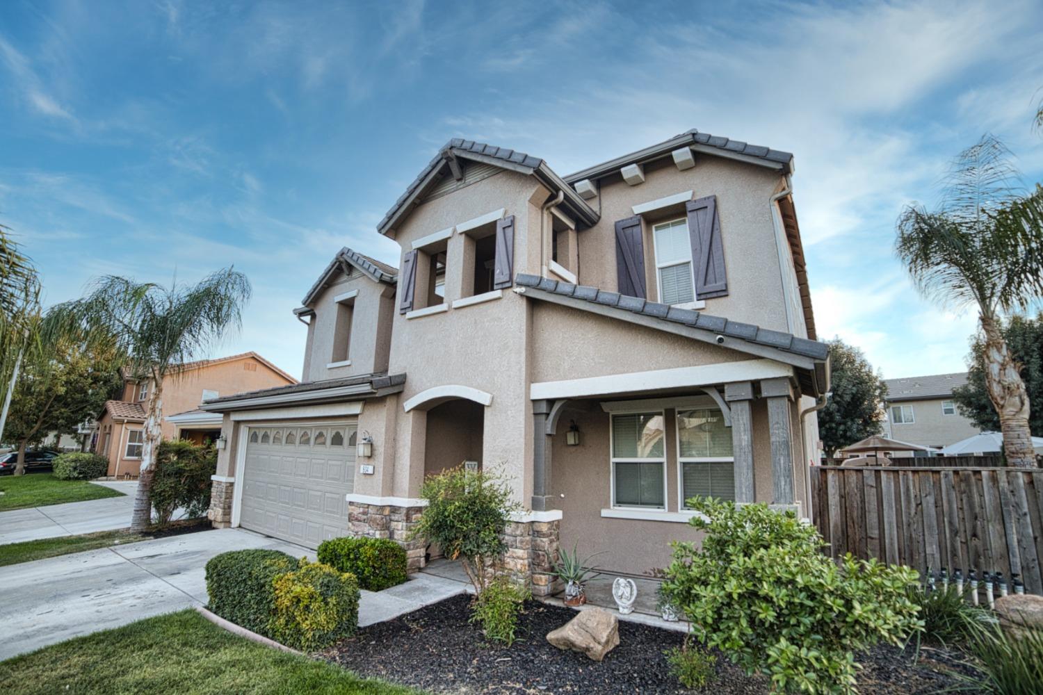 804 Pear Street Madera, CA 93638 - Photo 3 of 27 a front view of a house with a yard