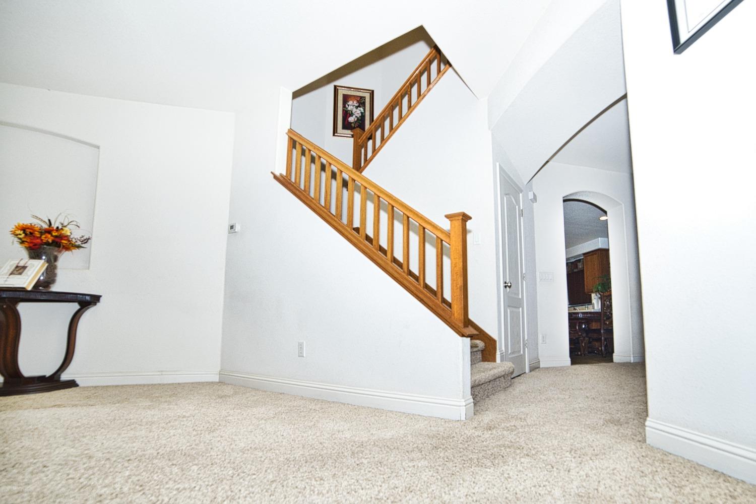 804 Pear Street Madera, CA 93638 - Photo 5 of 27 a view of a hallway with staircase