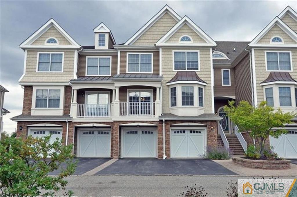 14 Raritan Reach Road, Unit 7 South Amboy, NJ 08879 - Photo 1 of 6 a front view of a house with a yard