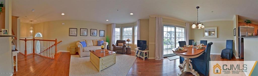 14 Raritan Reach Road, Unit 7 South Amboy, NJ 08879 - Photo 4 of 6 a living room with furniture a chandelier and a chandelier