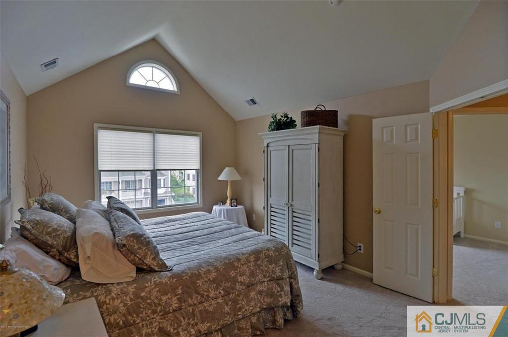 14 Raritan Reach Road, Unit 7 South Amboy, NJ 08879 - Photo 5 of 6 a bedroom with a bed and a window