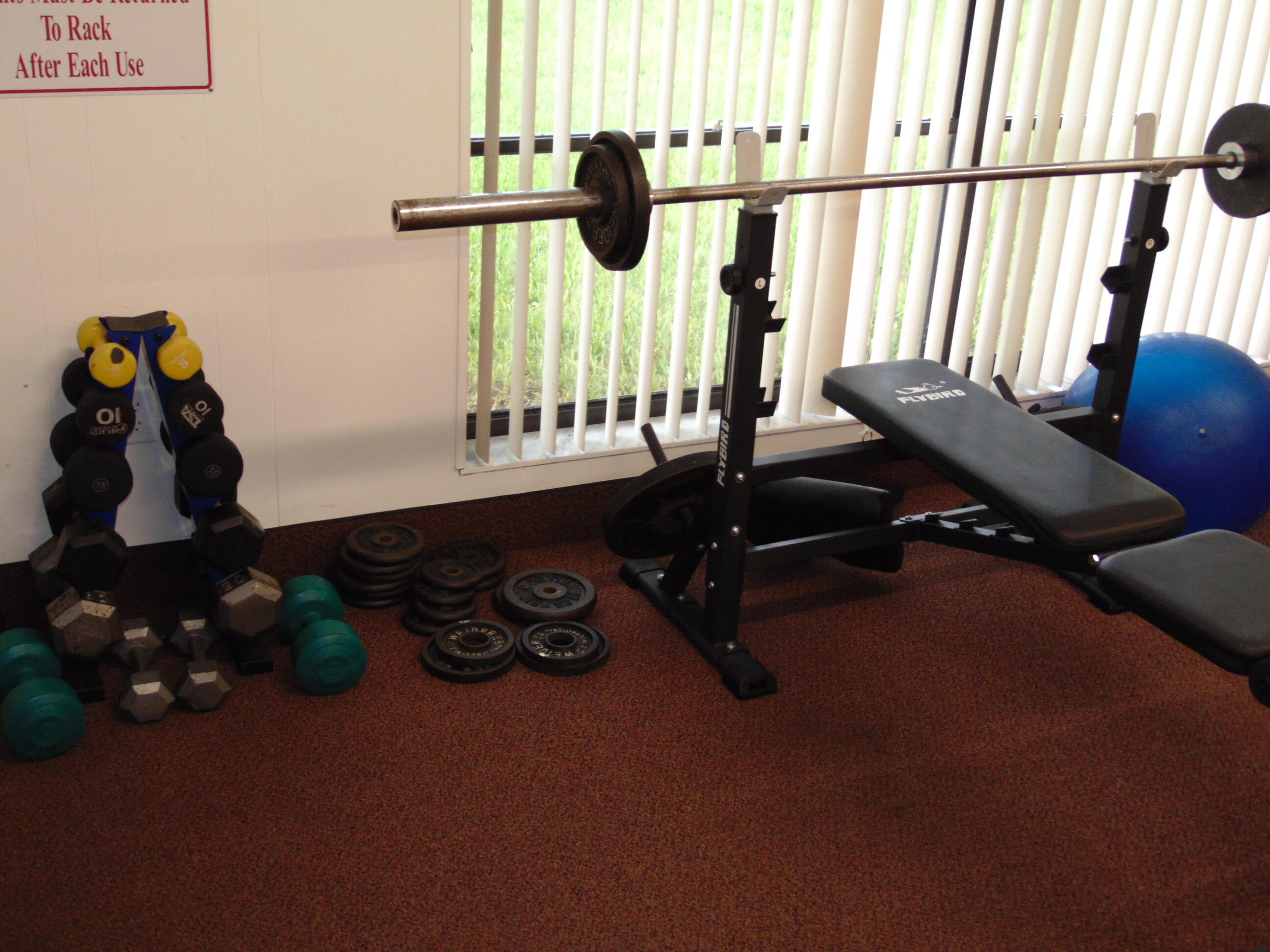 9220 Southwest 14th Street, Unit 3103 Boca Raton, FL 33428 - Photo 50 of 58 a room with gym equipment and a large window