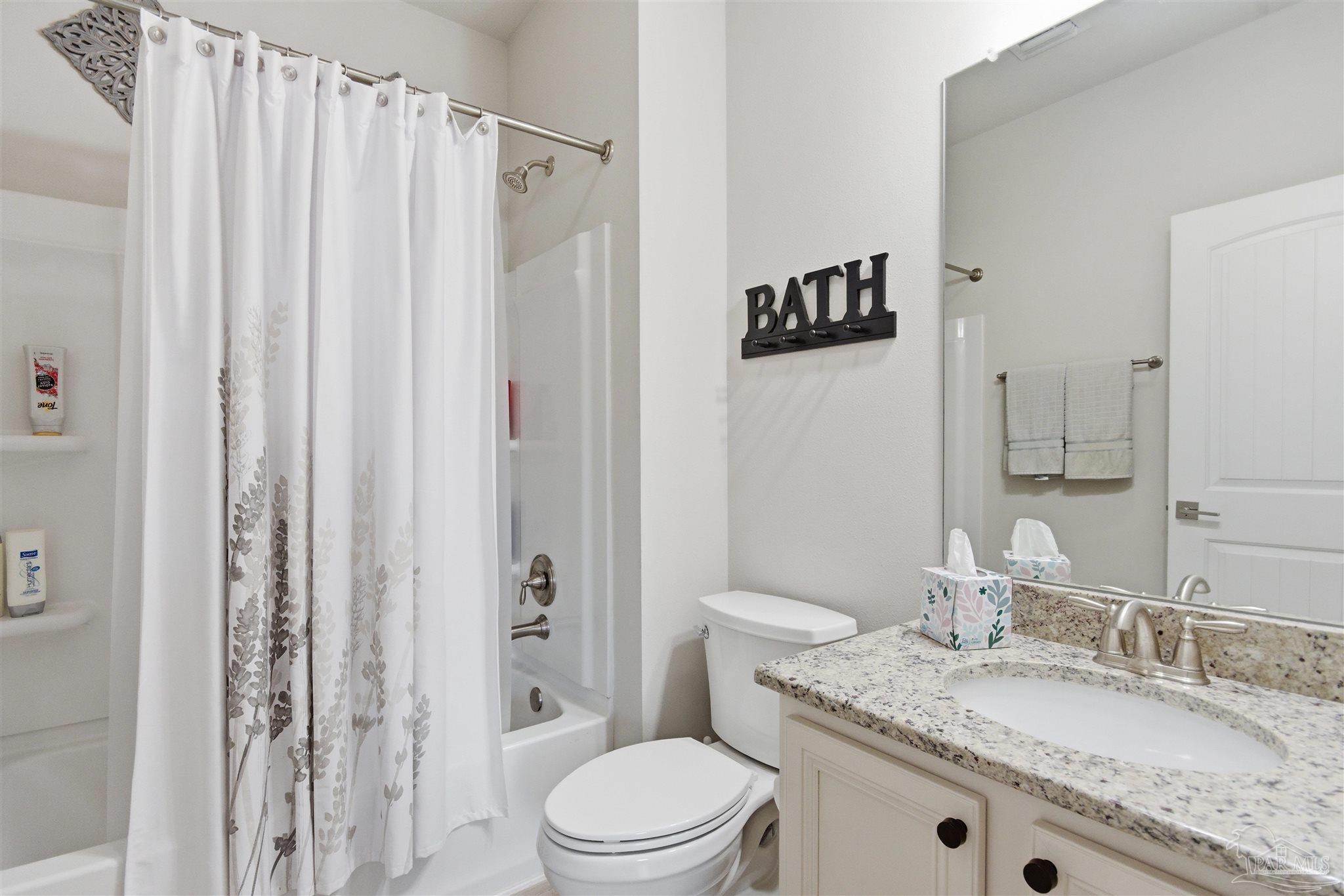 2677 Tulip Hill Road Pace, FL 32571 - Photo 30 of 35 a bathroom with a granite countertop sink toilet and shower