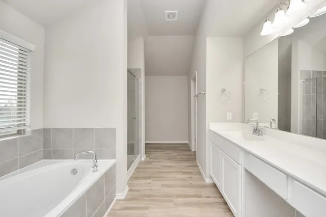 a bathroom with a sink vanity granite and a mirror