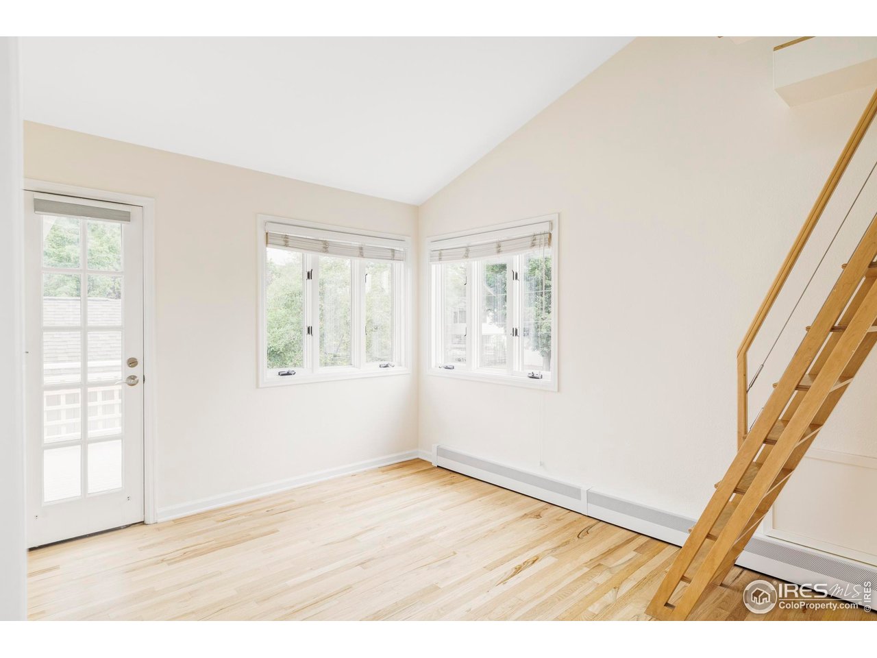 2085 Alpine Dr. Boulder, CO 80304 - Photo 17 of 23 a view of an empty room with wooden floor and a window