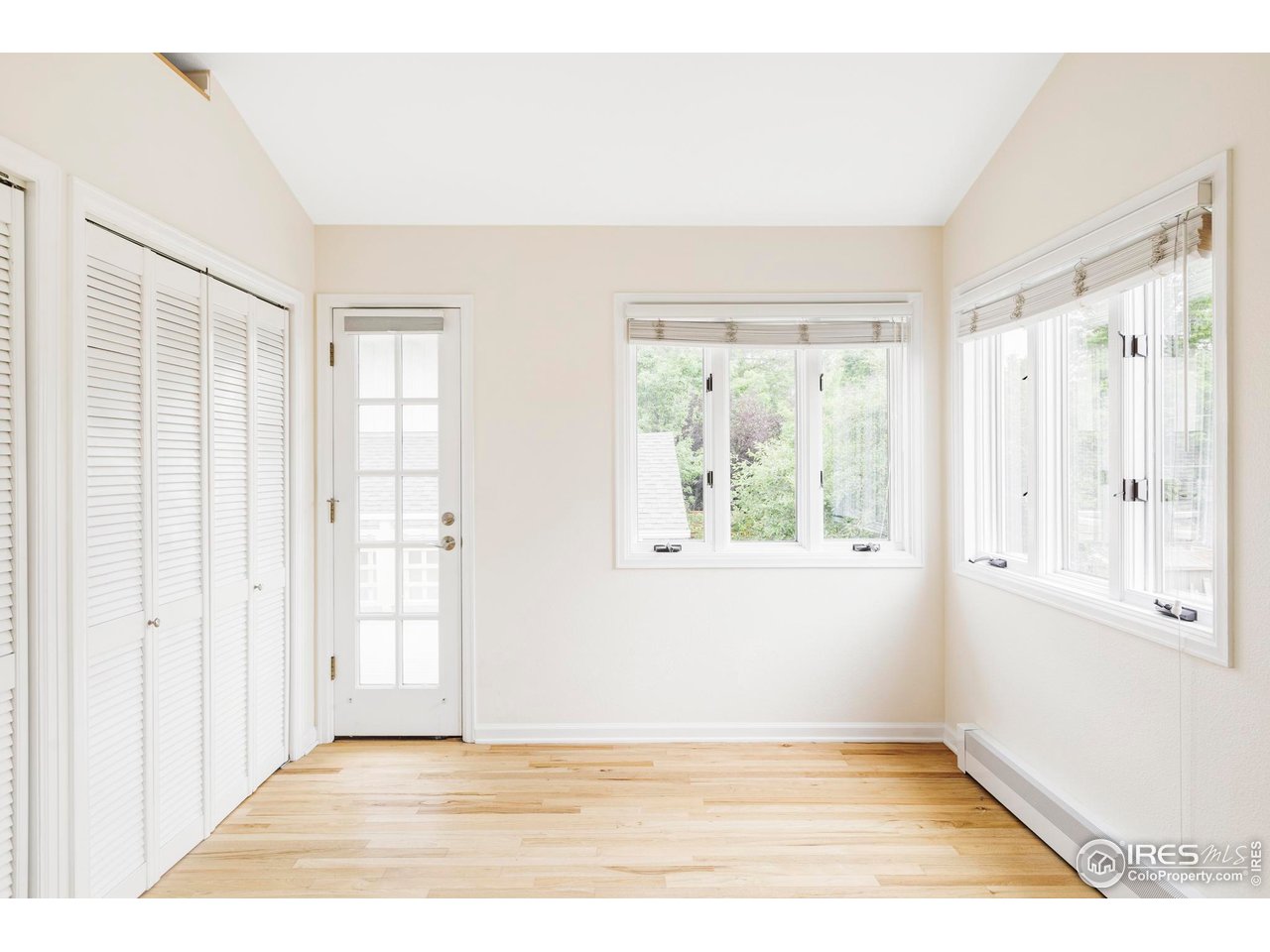 2085 Alpine Dr. Boulder, CO 80304 - Photo 18 of 23 a view of an empty room with wooden floor and a window