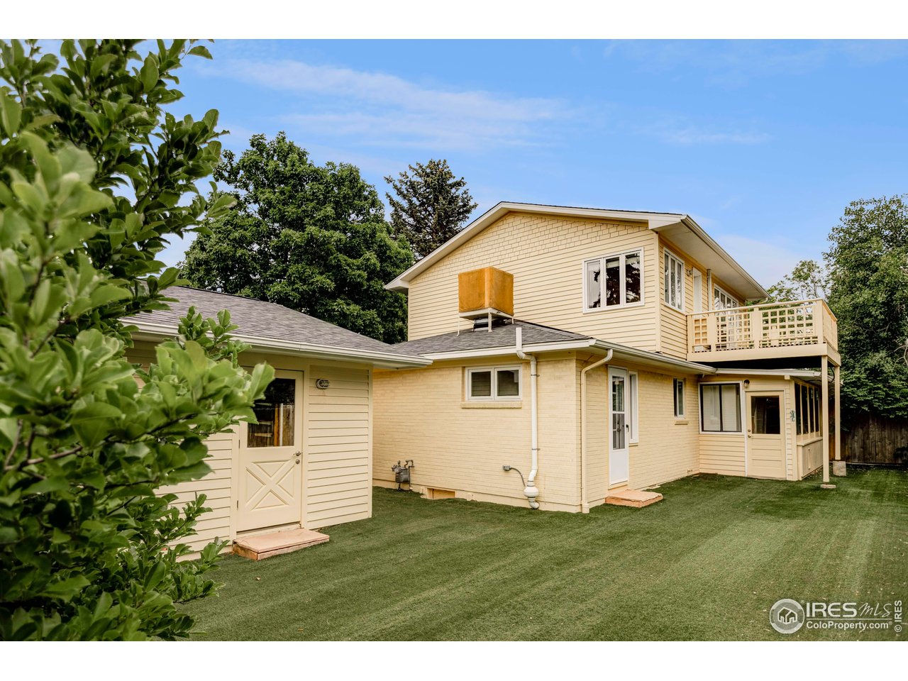 2085 Alpine Dr. Boulder, CO 80304 - Photo 23 of 23 a view of a yard in front of a house with a large tree