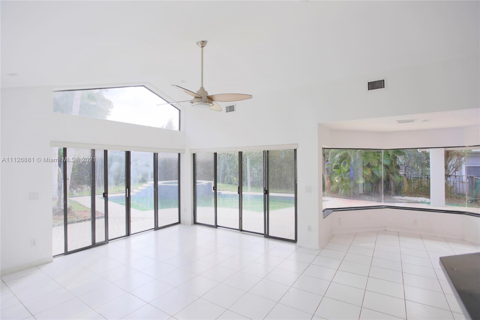 10726 Santa Rosa Drive Boca Raton, FL 33498 - Photo 11 of 26 a view of an empty room with windows