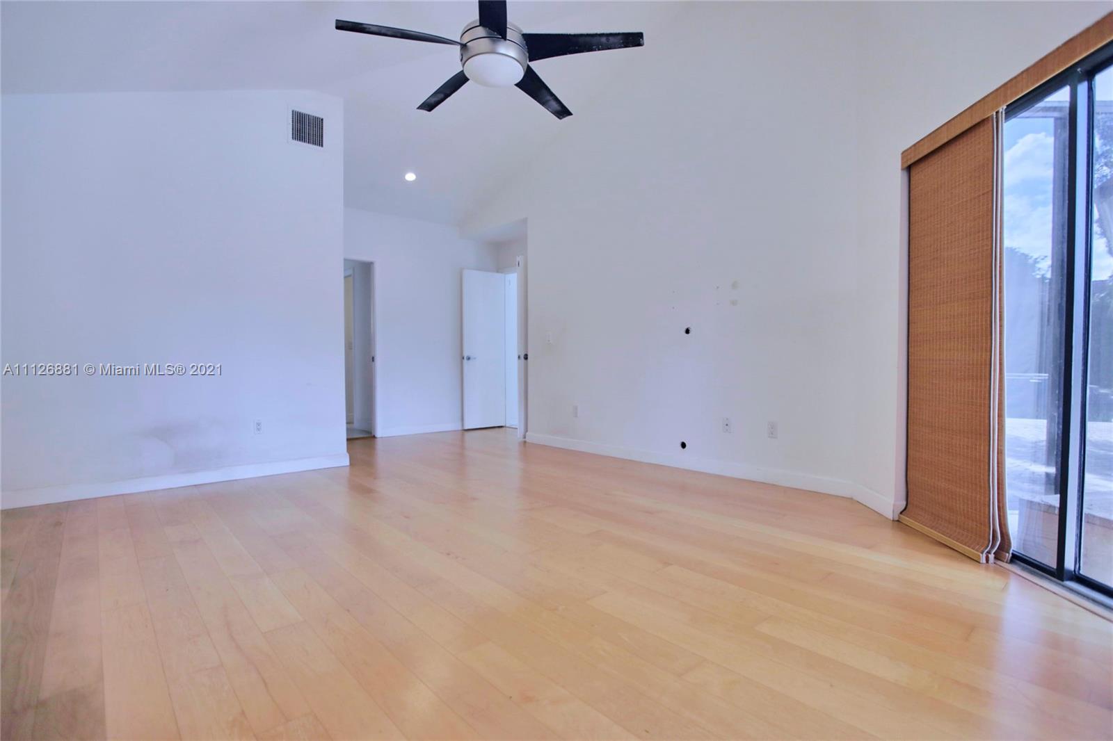 10726 Santa Rosa Drive Boca Raton, FL 33498 - Photo 16 of 26 wooden floor in an empty room