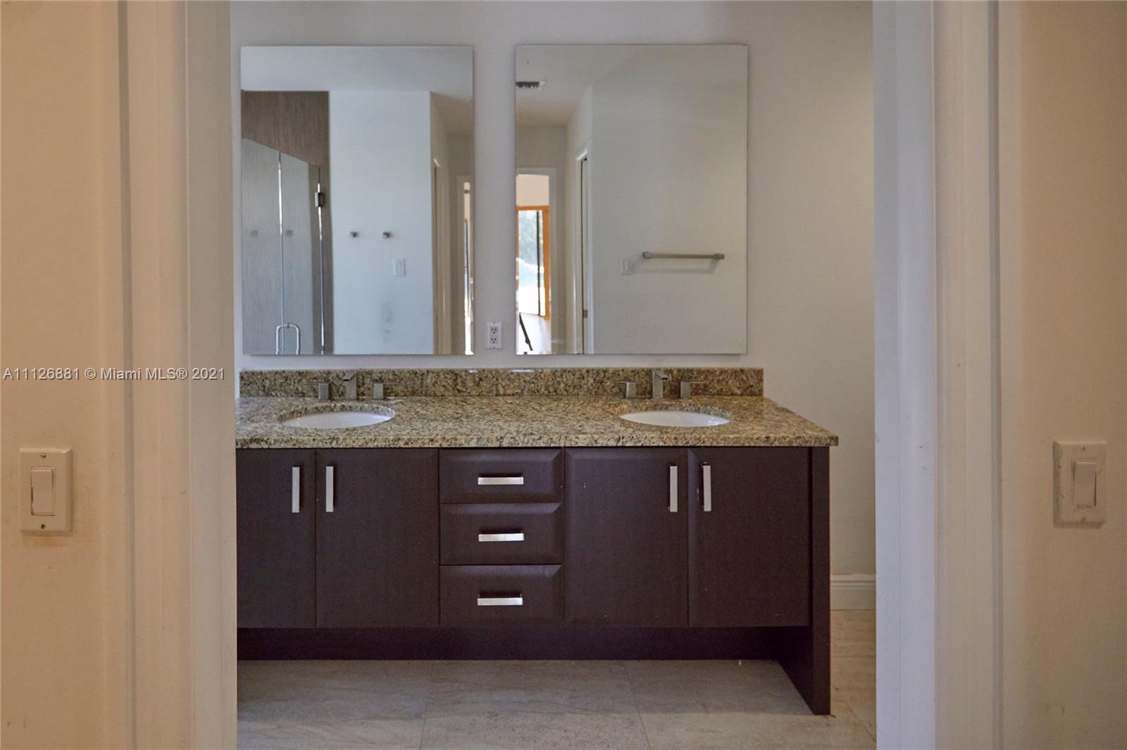 10726 Santa Rosa Drive Boca Raton, FL 33498 - Photo 18 of 26 a view of cabinets
