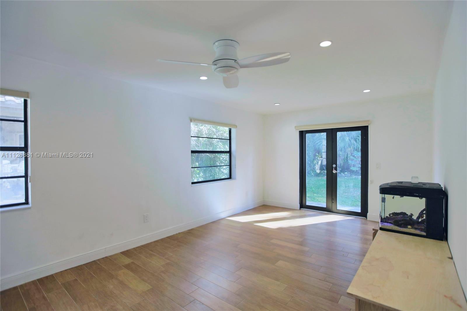 10726 Santa Rosa Drive Boca Raton, FL 33498 - Photo 22 of 26 a view of an empty room with a window and a fireplace