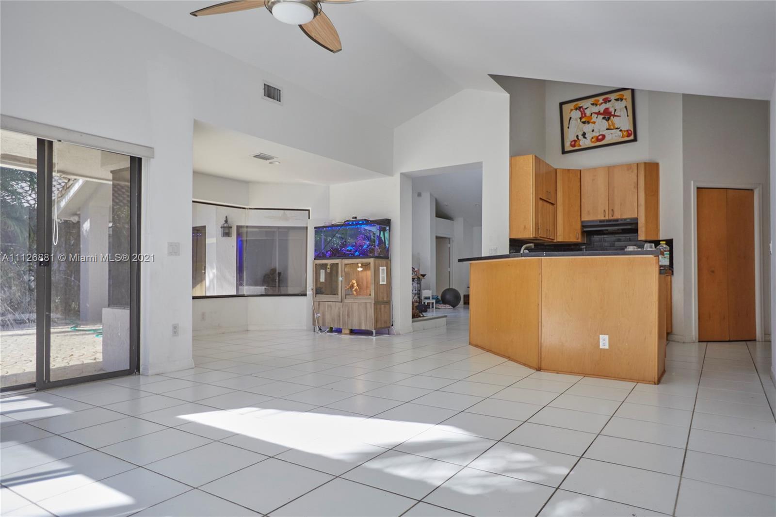10726 Santa Rosa Drive Boca Raton, FL 33498 - Photo 8 of 26 a kitchen with stainless steel appliances a refrigerator and a counter space