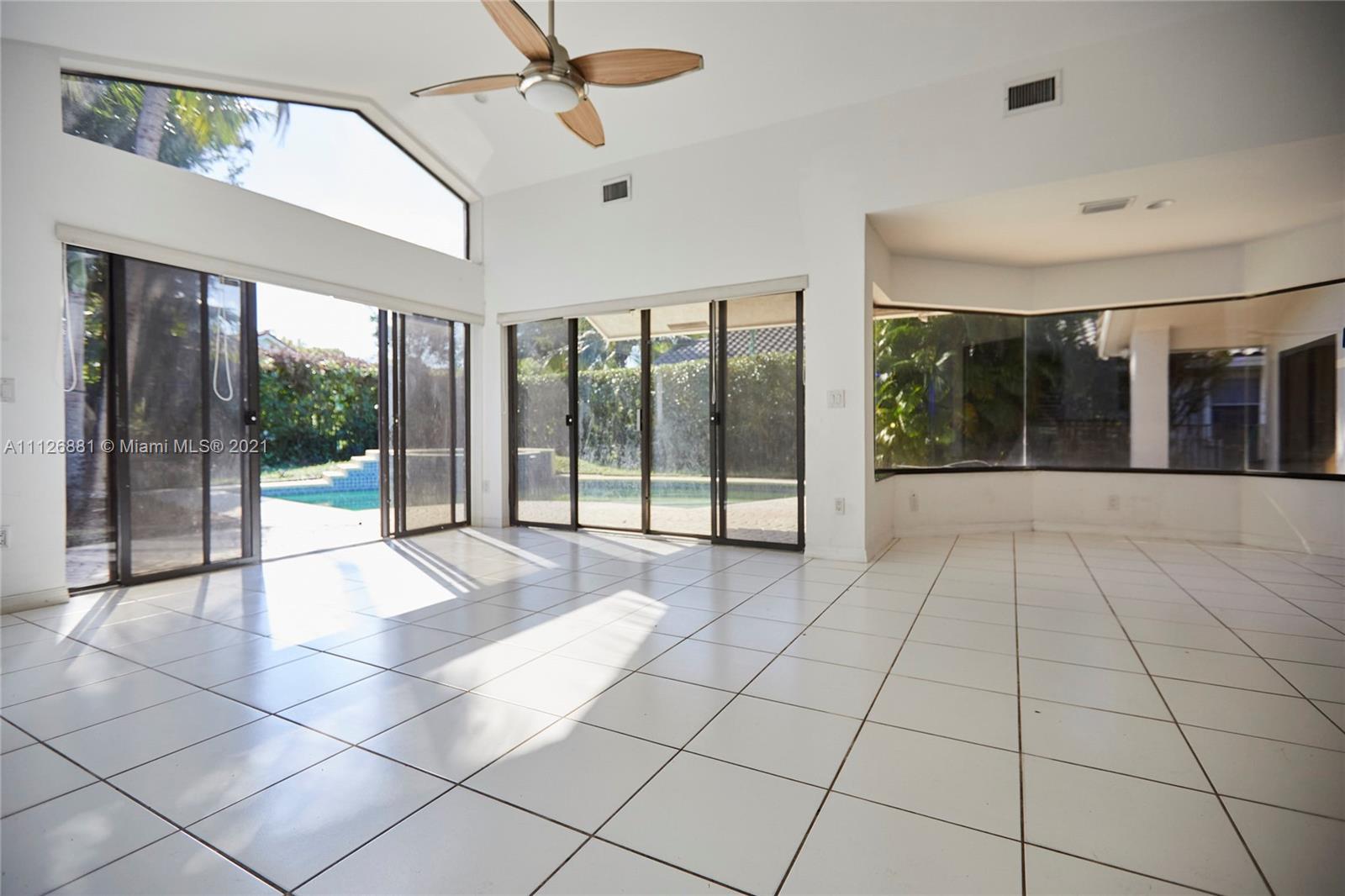 10726 Santa Rosa Drive Boca Raton, FL 33498 - Photo 9 of 26 a view of an entryway with a glass door