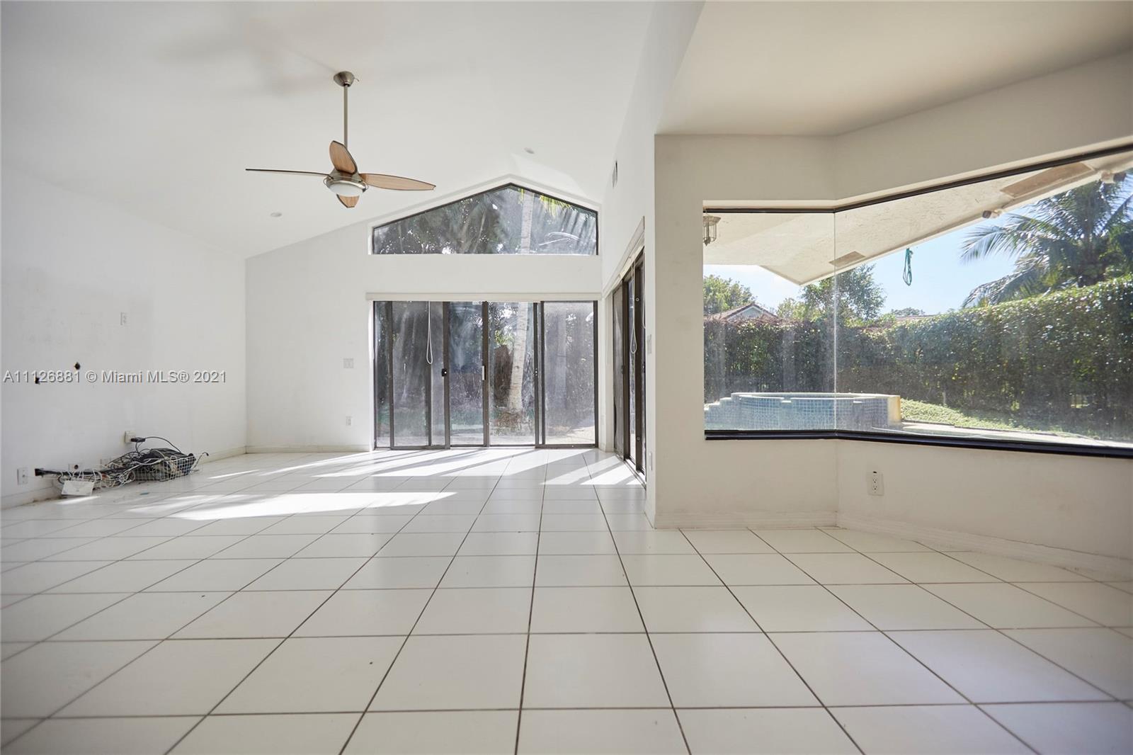 10726 Santa Rosa Drive Boca Raton, FL 33498 - Photo 10 of 26 a view of an empty room with a window