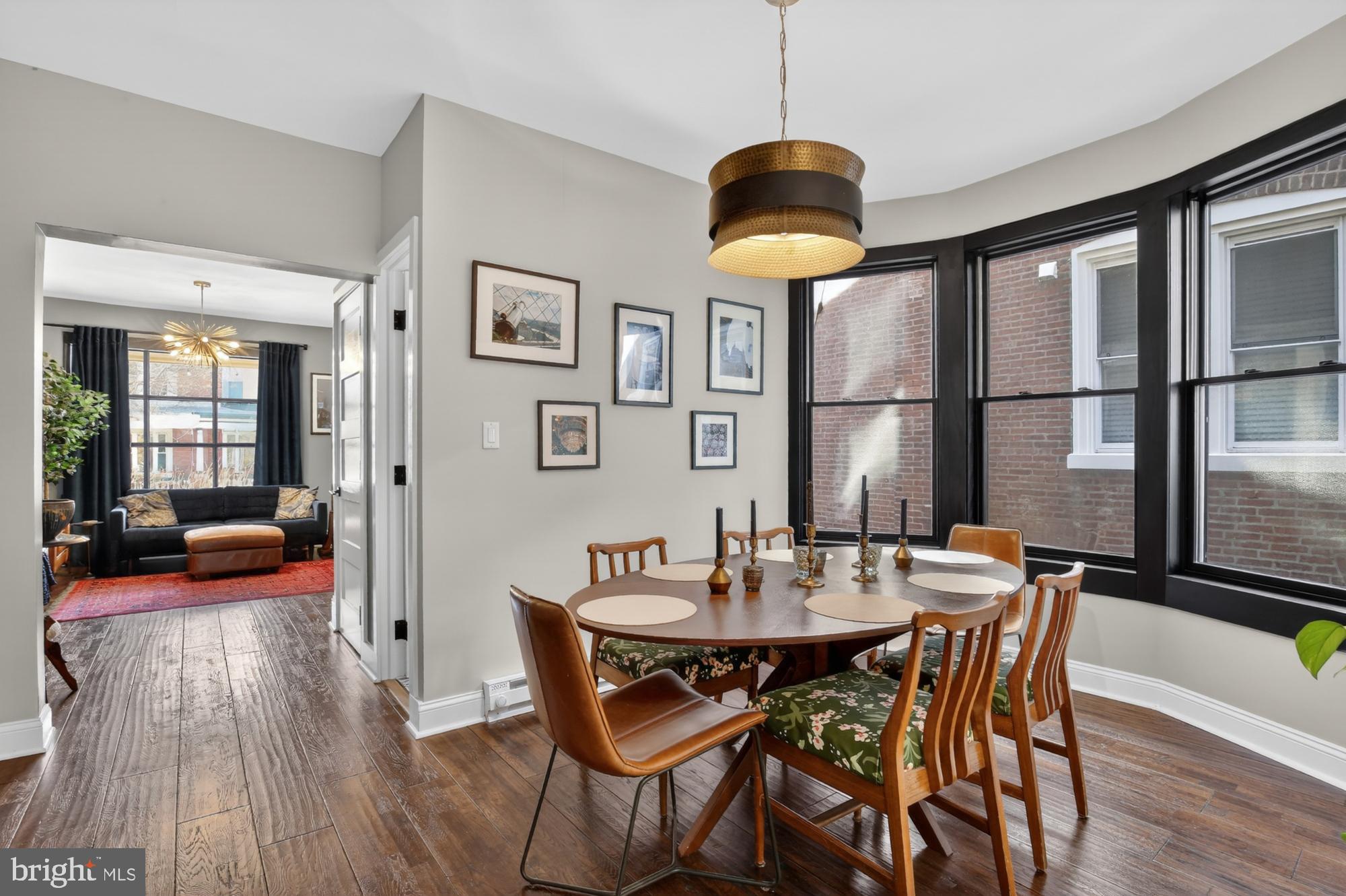 4315 Lauriston Street Philadelphia, PA 19128 - Photo 13 of 43 a dining room with furniture a chandelier and wooden floor