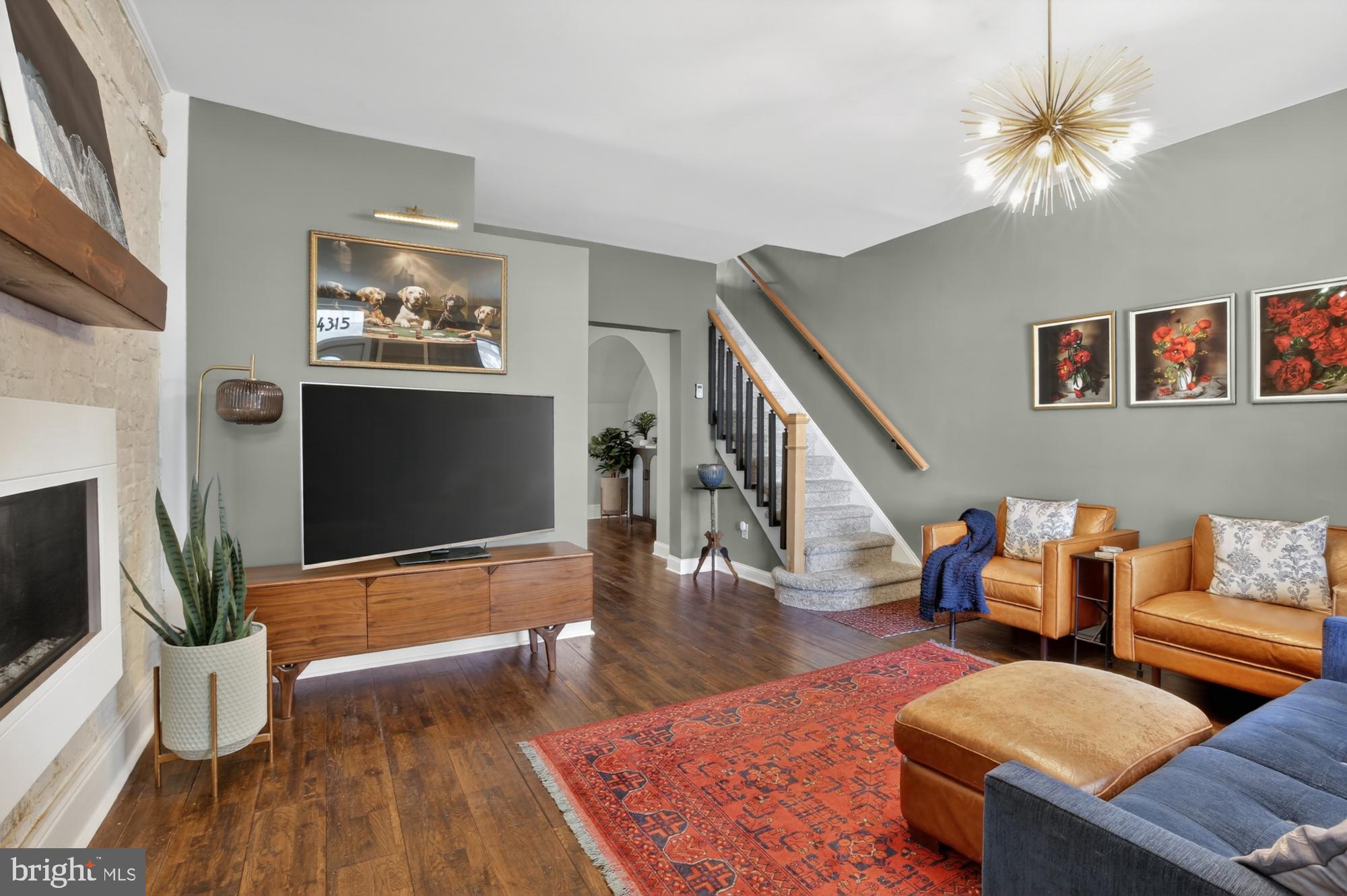 4315 Lauriston Street Philadelphia, PA 19128 - Photo 2 of 43 a living room with furniture and a flat screen tv