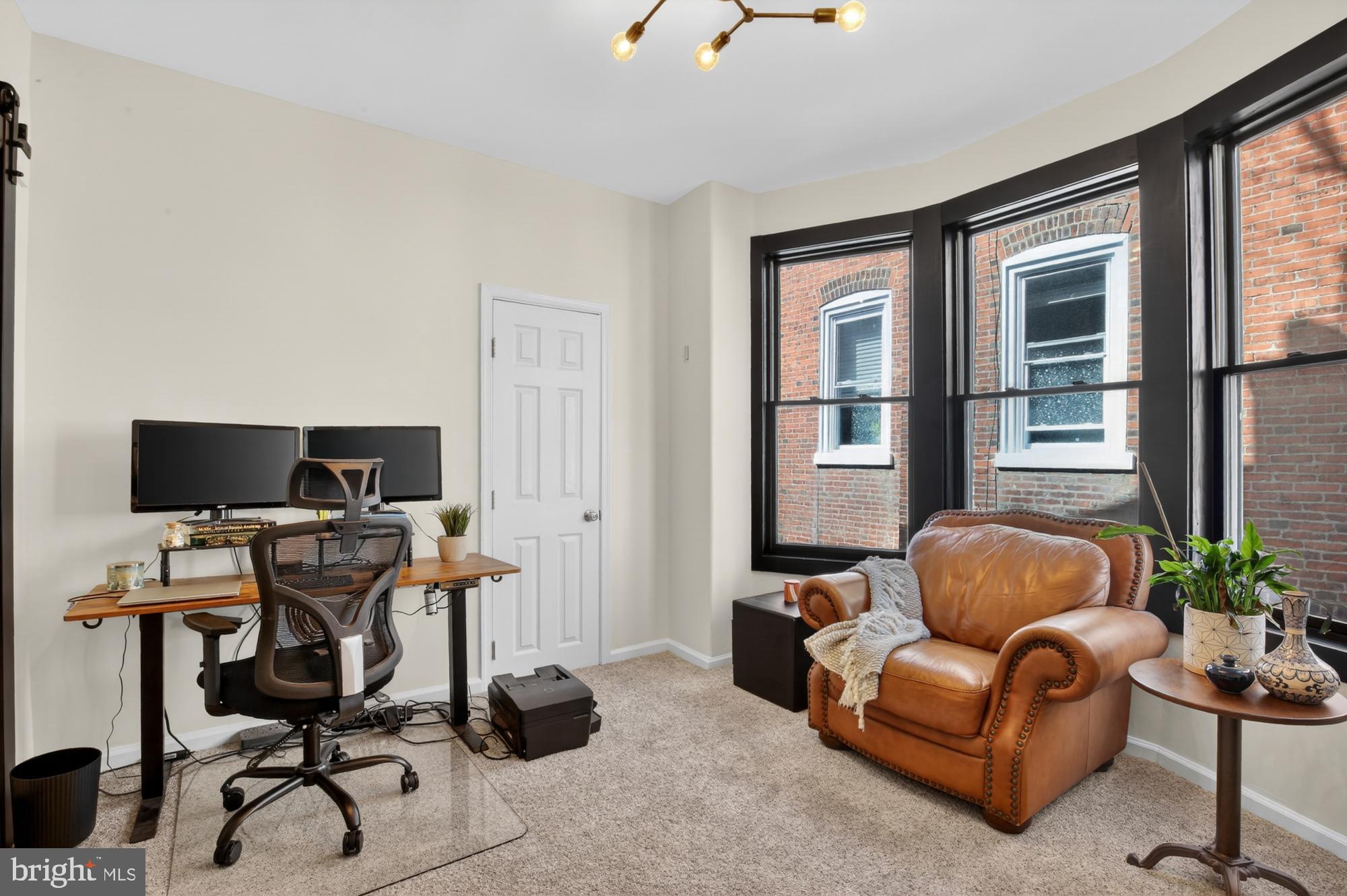 4315 Lauriston Street Philadelphia, PA 19128 - Photo 26 of 43 a livingroom with workspace and a couch