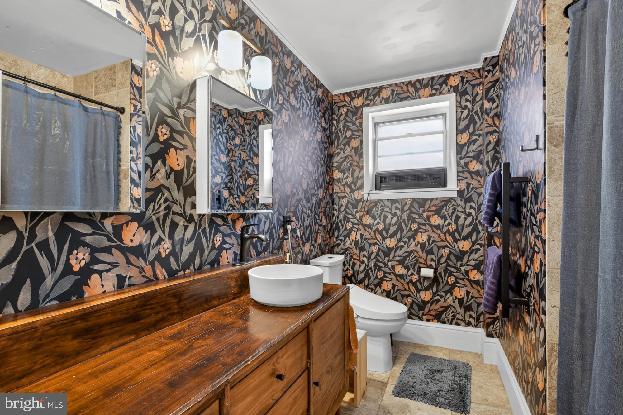 4315 Lauriston Street Philadelphia, PA 19128 - Photo 27 of 43 a bathroom with a sink toilet and shower