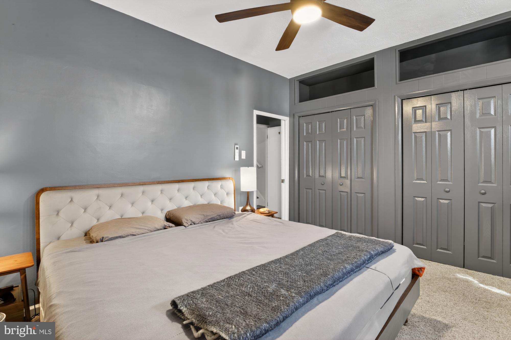 4315 Lauriston Street Philadelphia, PA 19128 - Photo 30 of 43 a bedroom with a large bed and a chandelier