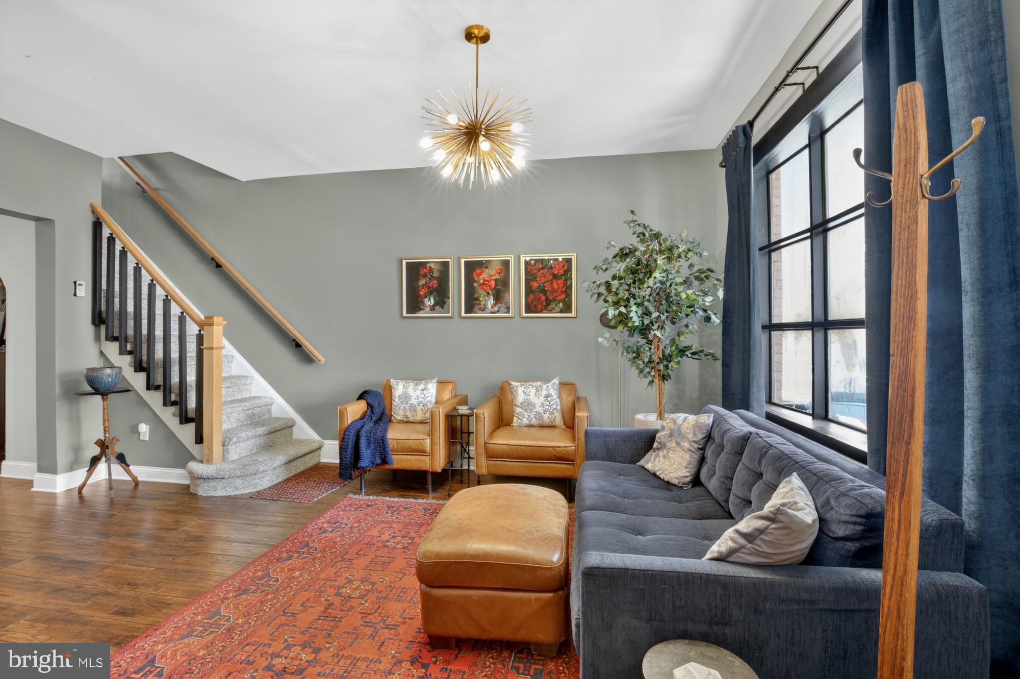 4315 Lauriston Street Philadelphia, PA 19128 - Photo 3 of 43 a living room with furniture and stairs