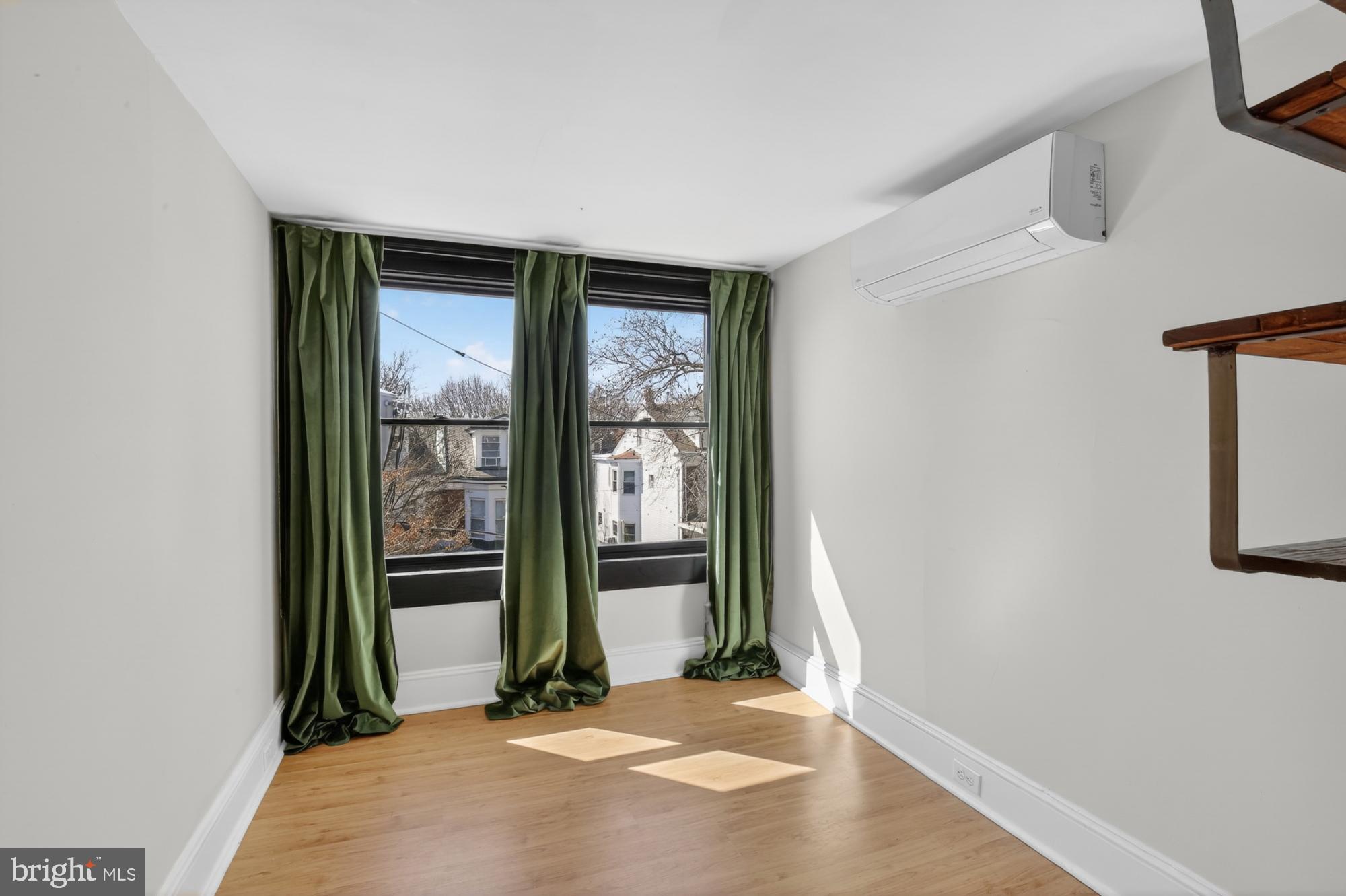 4315 Lauriston Street Philadelphia, PA 19128 - Photo 35 of 43 an empty room with large window and front door