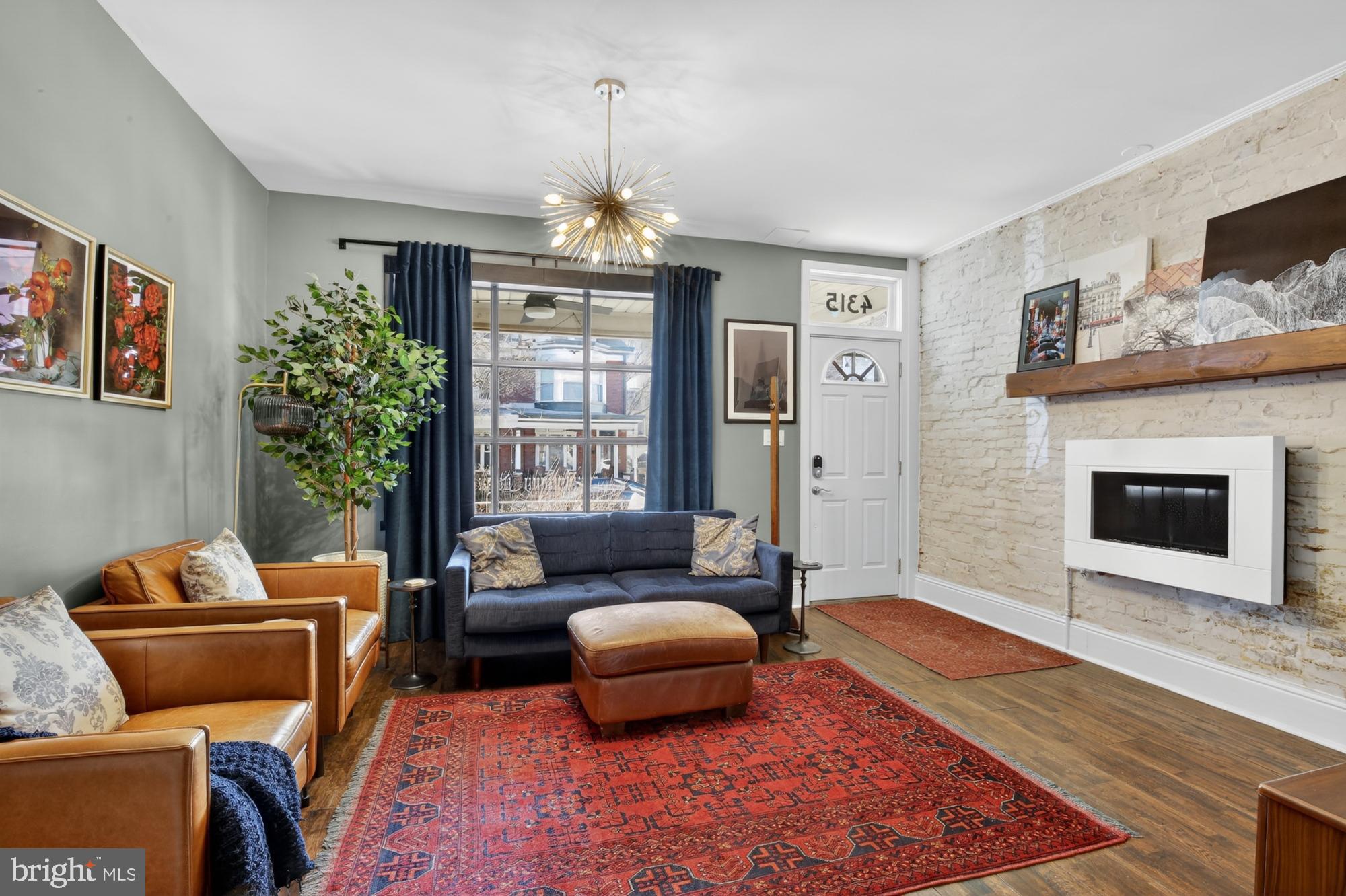 4315 Lauriston Street Philadelphia, PA 19128 - Photo 6 of 43 a living room with furniture and a fireplace
