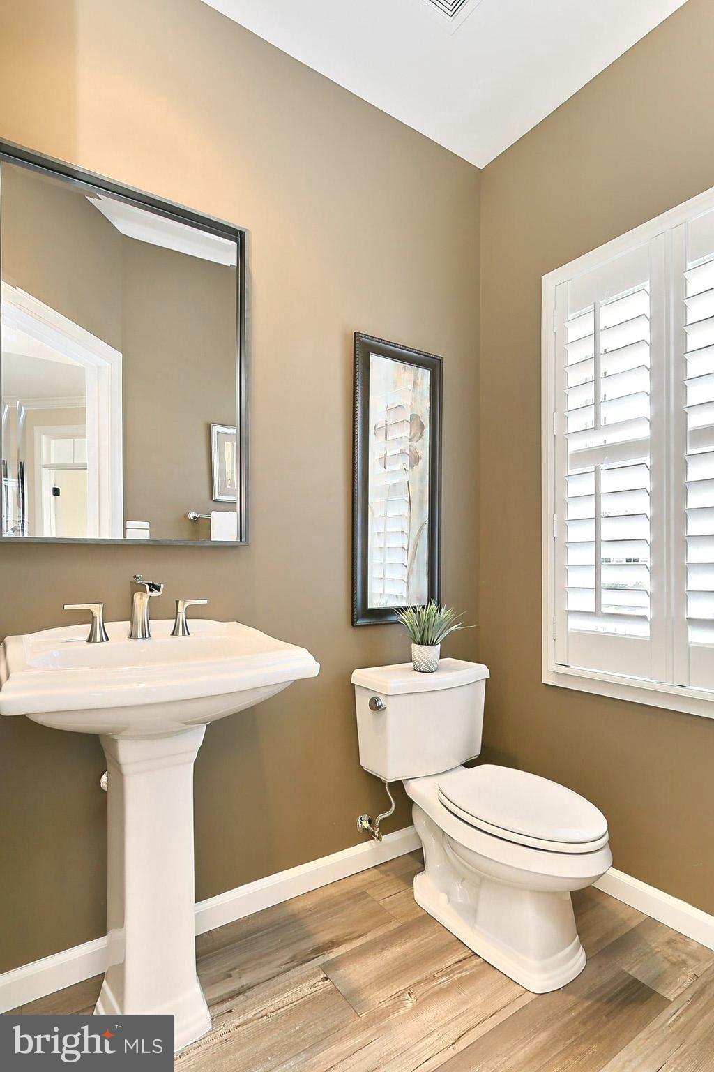 42440 Spring Splendor Drive Brambleton, VA 20148 - Photo 16 of 69 Main Lvl Half Bath w/ New Luxury Flooring