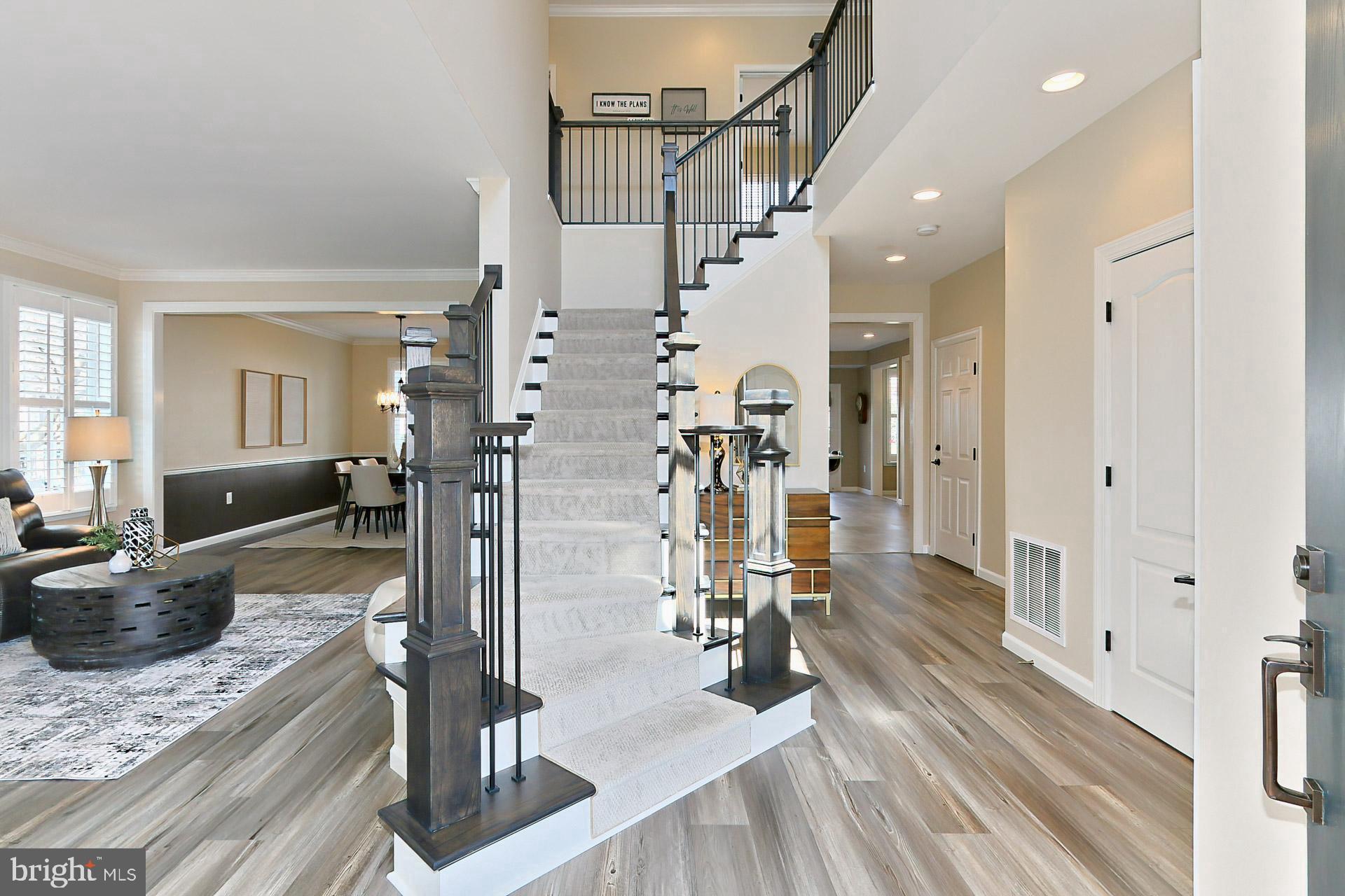 42440 Spring Splendor Drive Brambleton, VA 20148 - Photo 3 of 69 New Foyer Staircase and New Luxury Flooring