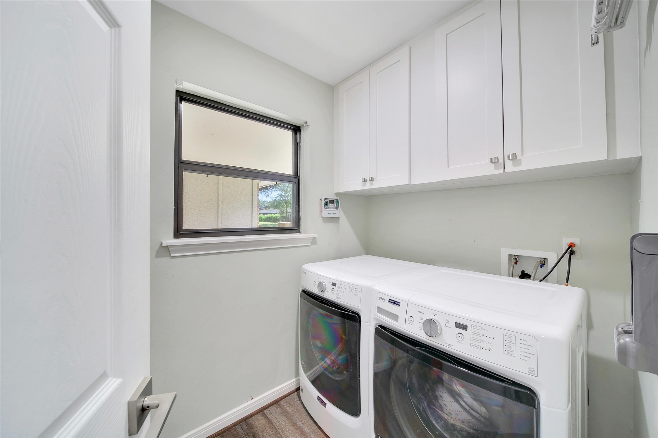 4402 Fallbrook Drive Houston, TX 77018 - Photo 18 of 29 Dedicated laundry room with upper cabinetry for extra storage.