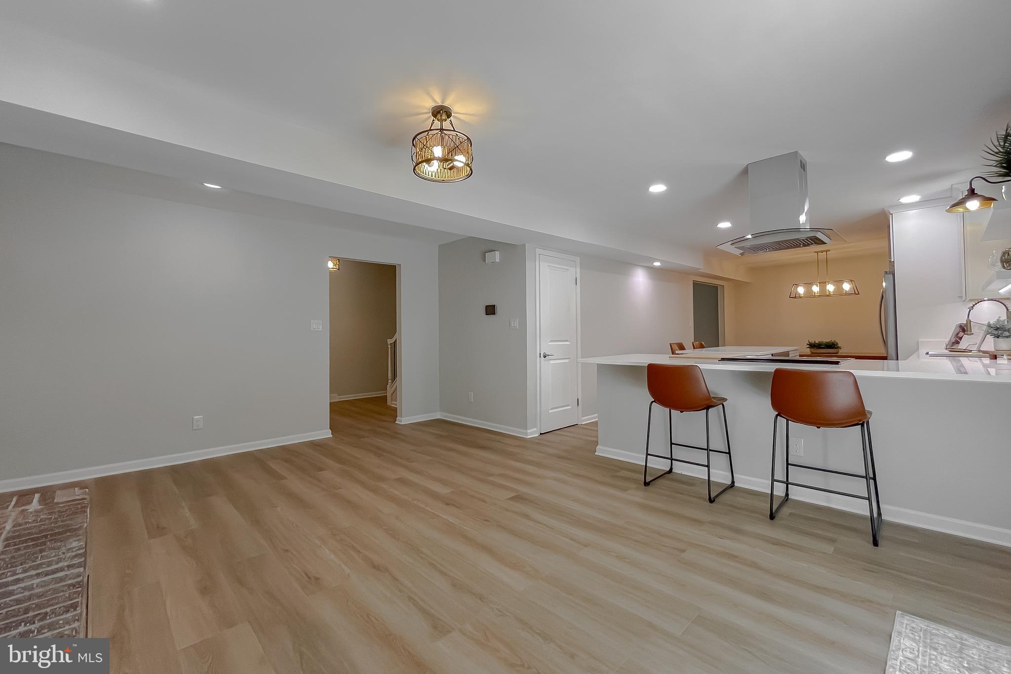 22373 Enoch Road Leonardtown, MD 20650 - Photo 28 of 74 a view of an empty room with a kitchen