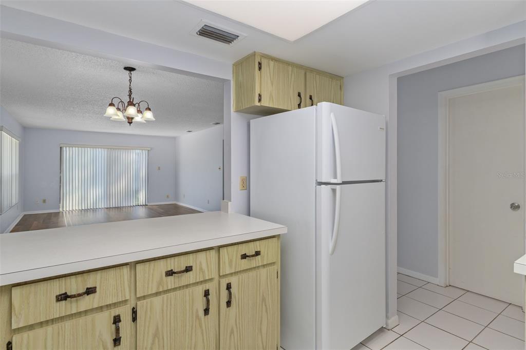 72 Chinaberry Circle Homosassa, FL 34446 - Photo 17 of 56 a kitchen with a refrigerator and a sink